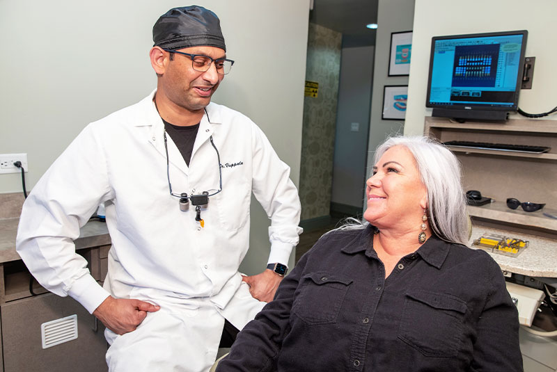 dr vuppala with dental patient